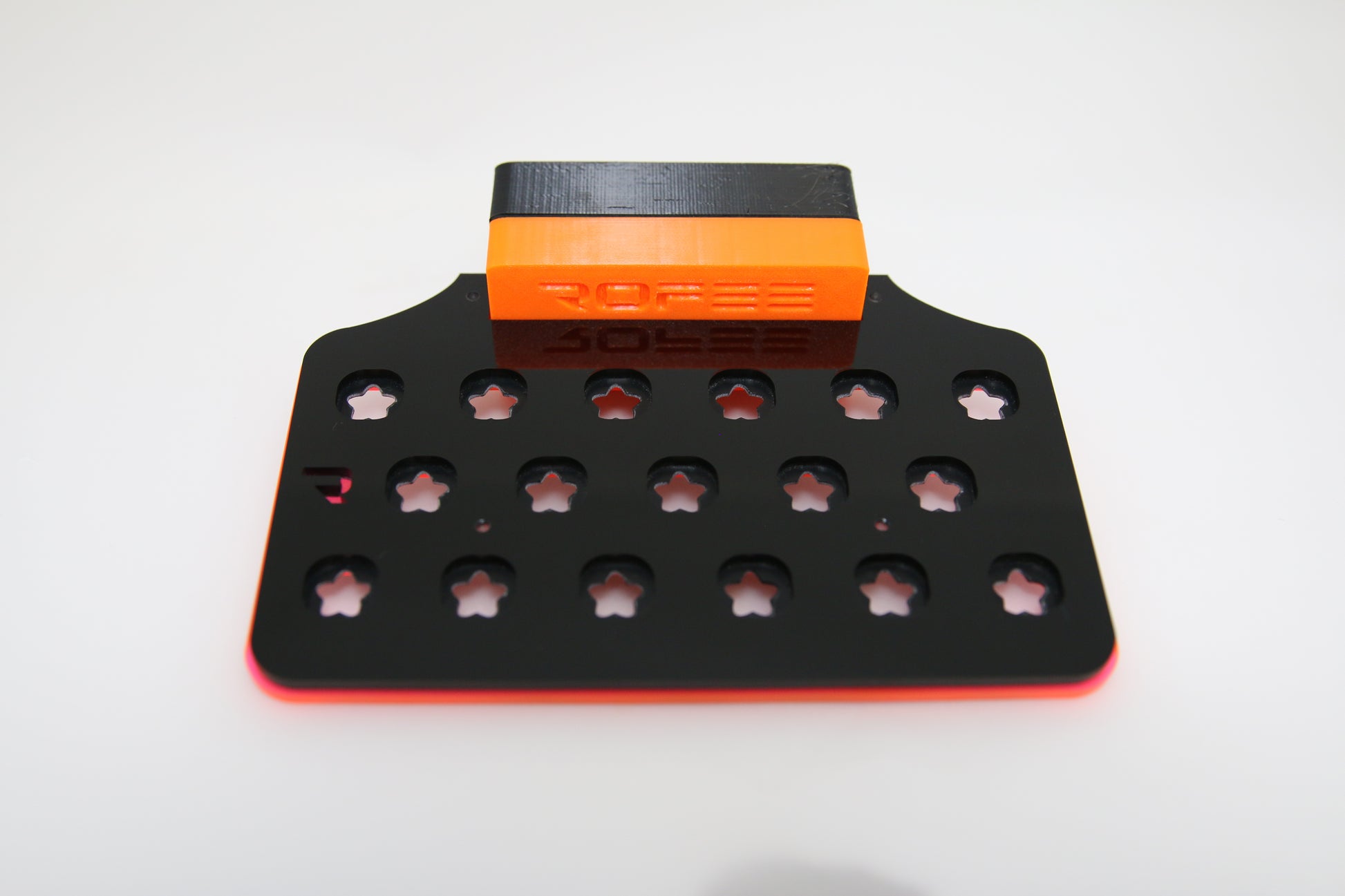 •“Top view of 17 plug coral frag rack with acrylic base”
•“Side view showing 3D printed inserts and acetate locks”
•“Mounted frag rack on glass with magnetic hold”